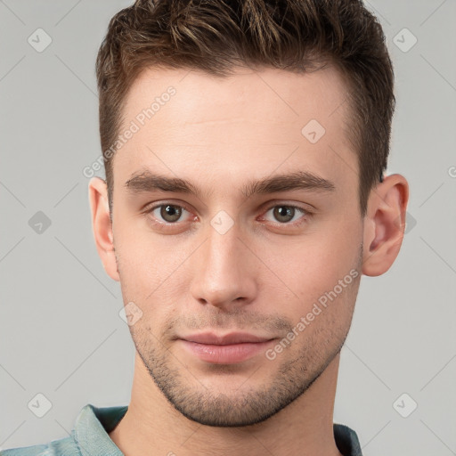 Neutral white young-adult male with short  brown hair and brown eyes