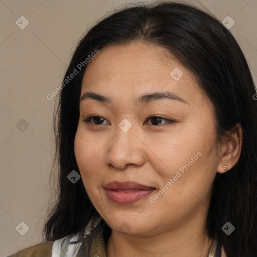 Joyful asian adult female with medium  brown hair and brown eyes