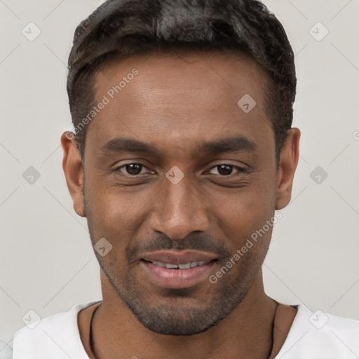 Joyful black young-adult male with short  brown hair and brown eyes