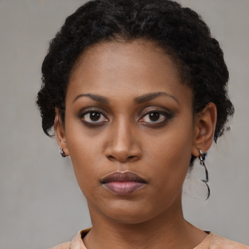 Neutral black young-adult female with short  black hair and brown eyes