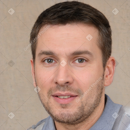 Joyful white adult male with short  brown hair and brown eyes