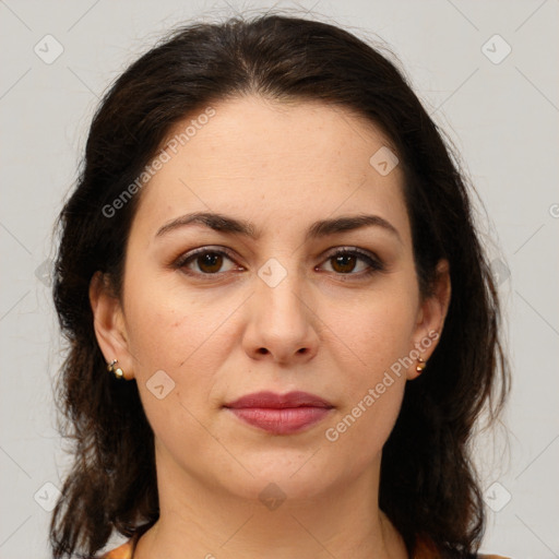 Joyful white adult female with medium  brown hair and brown eyes