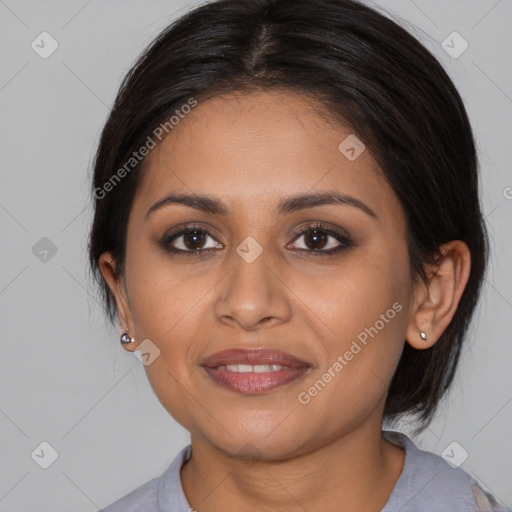 Joyful latino young-adult female with medium  brown hair and brown eyes