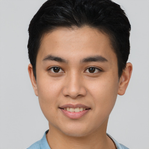 Joyful asian young-adult male with short  brown hair and brown eyes