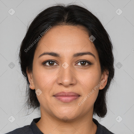 Joyful latino young-adult female with medium  brown hair and brown eyes