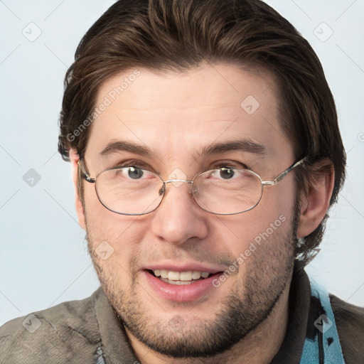 Joyful white adult male with short  brown hair and grey eyes