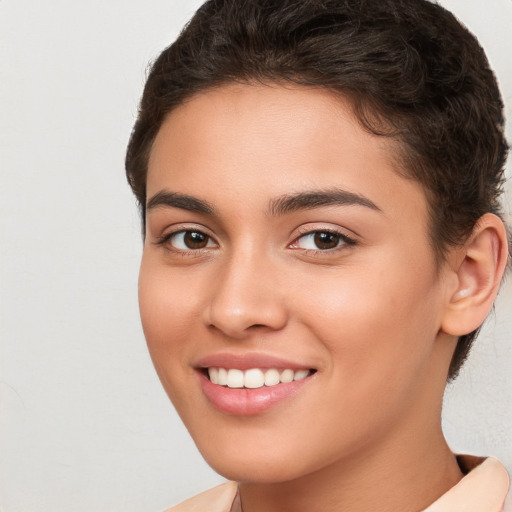 Joyful white young-adult female with short  brown hair and brown eyes