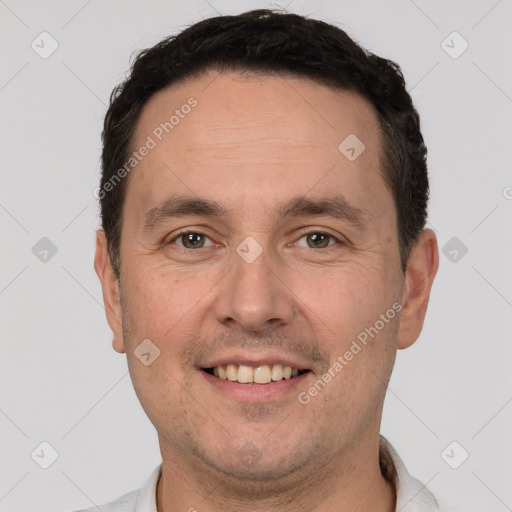 Joyful white adult male with short  brown hair and brown eyes