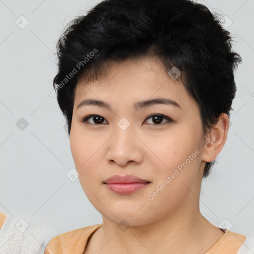 Joyful asian young-adult female with short  black hair and brown eyes