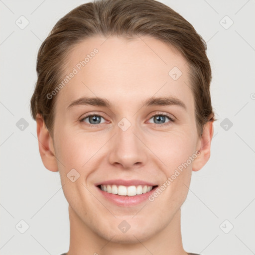 Joyful white young-adult female with short  brown hair and grey eyes