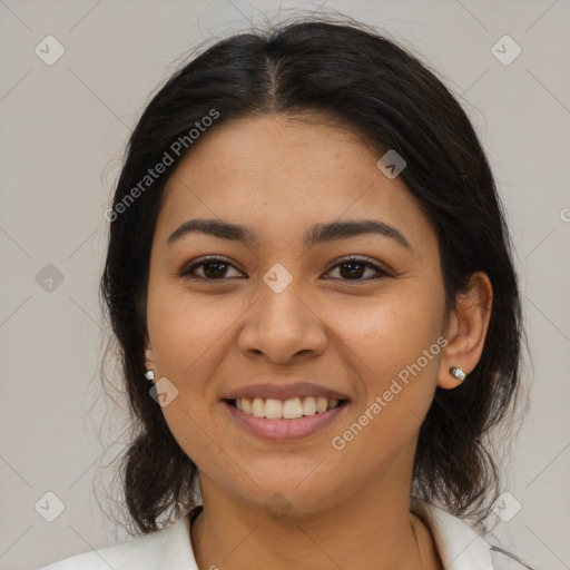 Joyful latino young-adult female with medium  brown hair and brown eyes