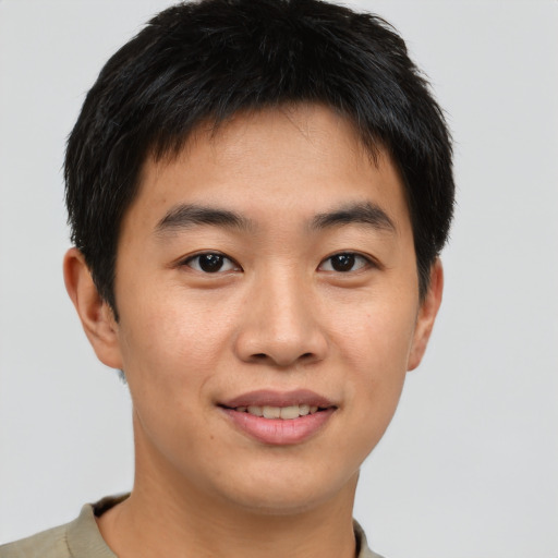 Joyful asian young-adult male with short  brown hair and brown eyes