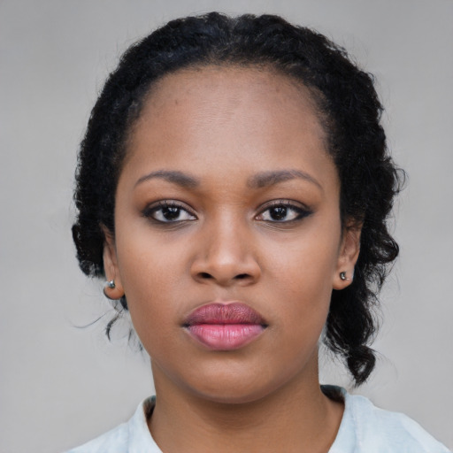Neutral black young-adult female with medium  black hair and brown eyes