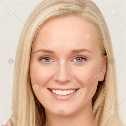 Joyful white young-adult female with long  brown hair and blue eyes