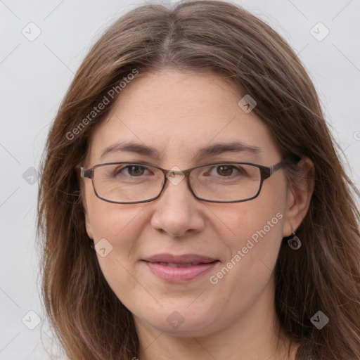 Joyful white adult female with long  brown hair and grey eyes