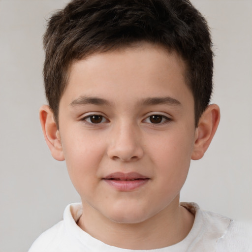 Joyful white child male with short  brown hair and brown eyes