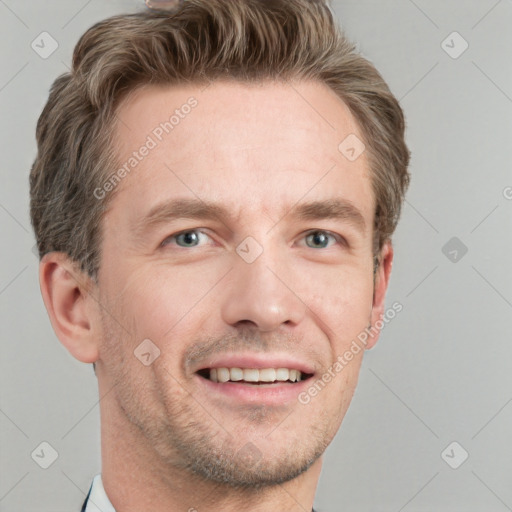 Joyful white adult male with short  brown hair and grey eyes