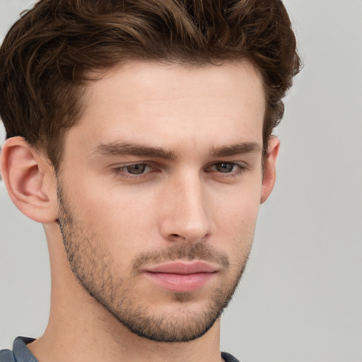 Neutral white young-adult male with short  brown hair and grey eyes