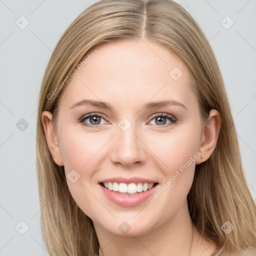 Joyful white young-adult female with long  brown hair and grey eyes