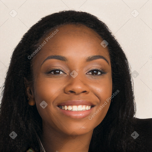 Joyful black young-adult female with long  brown hair and brown eyes