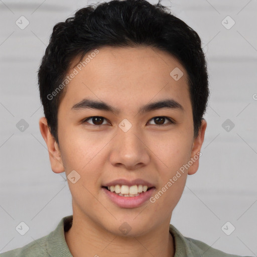 Joyful asian young-adult male with short  brown hair and brown eyes