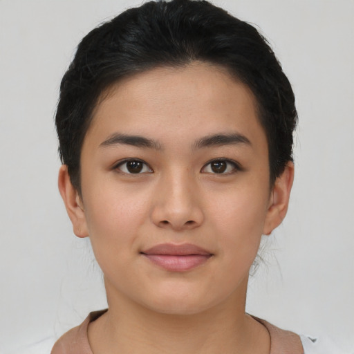 Joyful asian young-adult female with short  brown hair and brown eyes