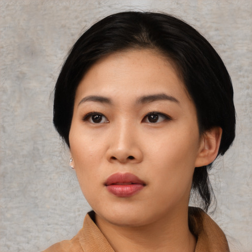 Neutral asian young-adult female with medium  black hair and brown eyes