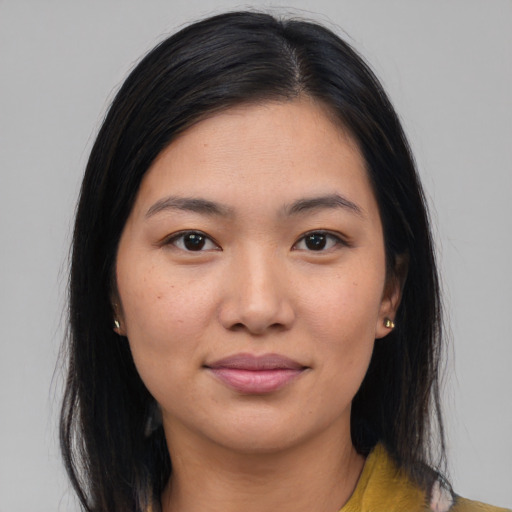 Joyful asian young-adult female with long  black hair and brown eyes