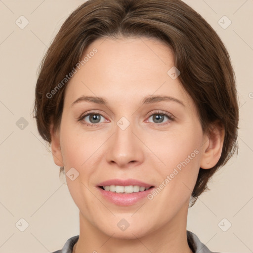 Joyful white adult female with short  brown hair and brown eyes