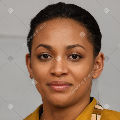 Joyful black young-adult female with short  black hair and brown eyes