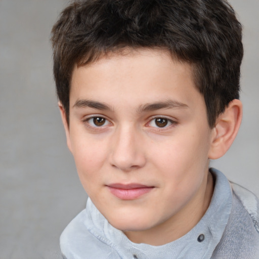 Joyful white child male with short  brown hair and brown eyes