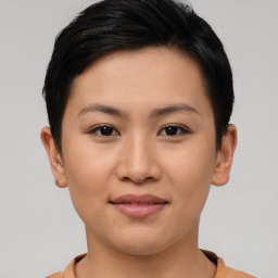 Joyful asian young-adult female with short  brown hair and brown eyes