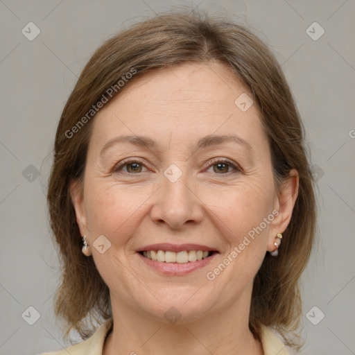 Joyful white adult female with medium  brown hair and grey eyes