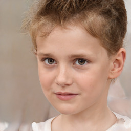 Joyful white child male with short  brown hair and brown eyes