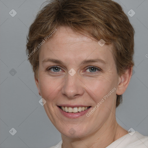 Joyful white adult female with short  brown hair and grey eyes