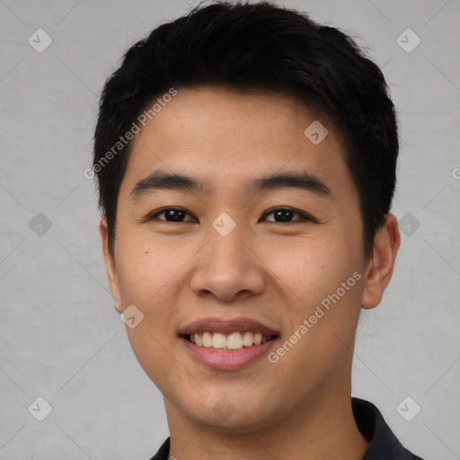 Joyful asian young-adult male with short  black hair and brown eyes