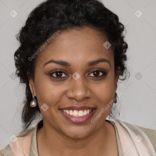 Joyful black young-adult female with long  brown hair and brown eyes