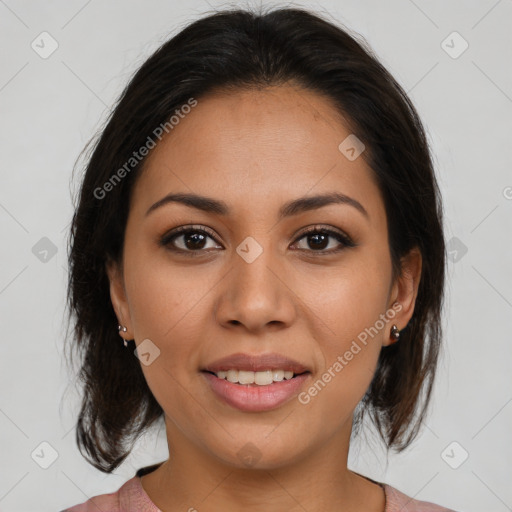 Joyful latino young-adult female with medium  brown hair and brown eyes