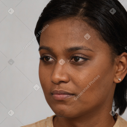 Neutral black young-adult female with short  brown hair and brown eyes