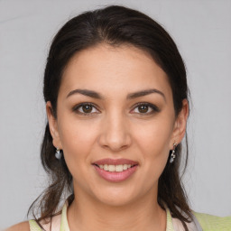 Joyful white young-adult female with medium  brown hair and brown eyes