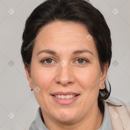 Joyful white adult female with short  brown hair and brown eyes