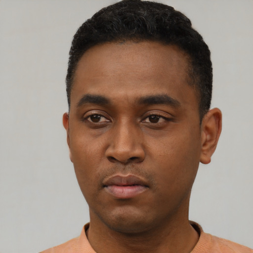 Neutral black young-adult male with short  black hair and brown eyes