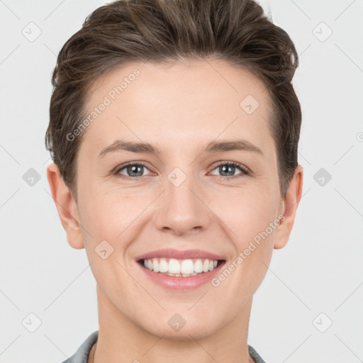 Joyful white young-adult female with short  brown hair and grey eyes