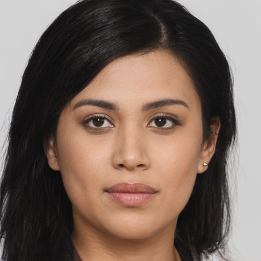 Joyful asian young-adult female with long  brown hair and brown eyes