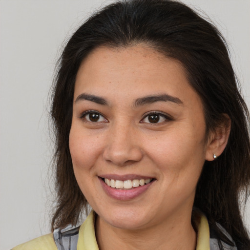 Joyful white young-adult female with medium  brown hair and brown eyes