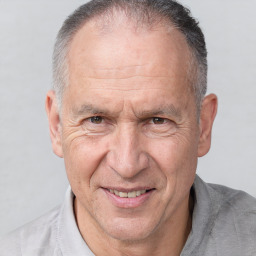 Joyful white middle-aged male with short  brown hair and brown eyes