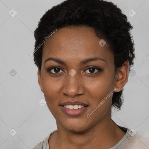 Joyful black young-adult female with short  black hair and brown eyes