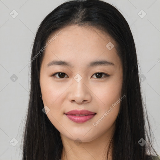 Joyful asian young-adult female with long  brown hair and brown eyes