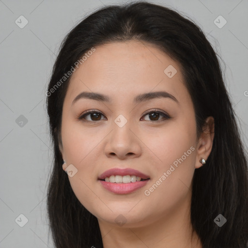 Joyful asian young-adult female with long  brown hair and brown eyes