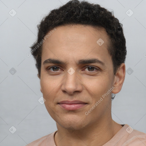 Joyful latino young-adult male with short  brown hair and brown eyes